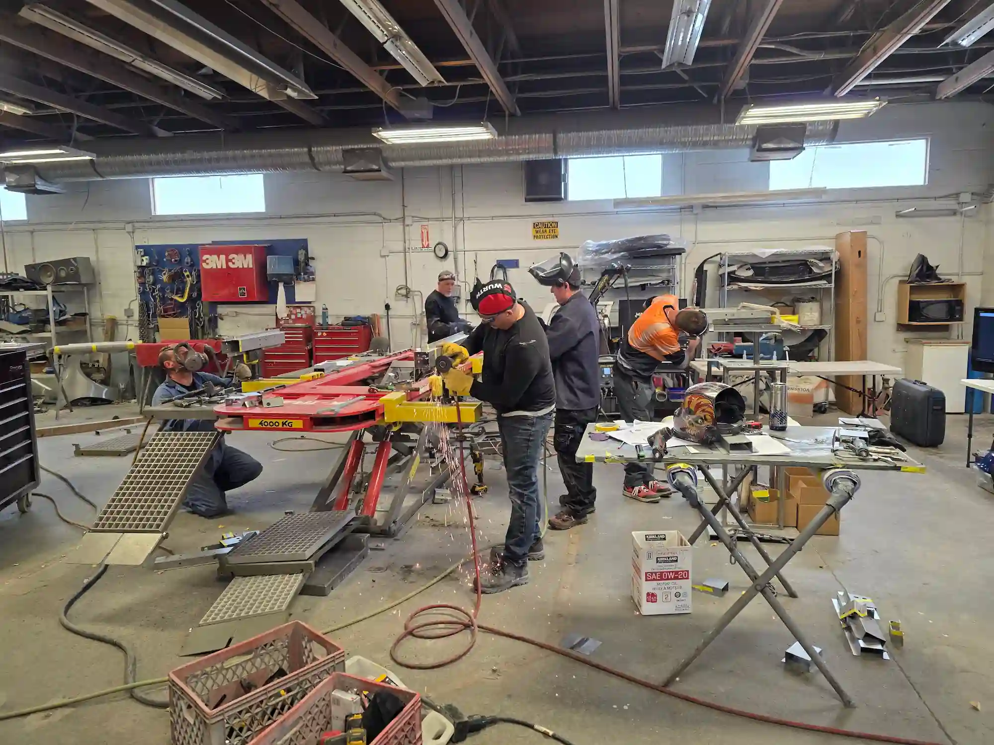 mechanics working together in Sooke's auto garage