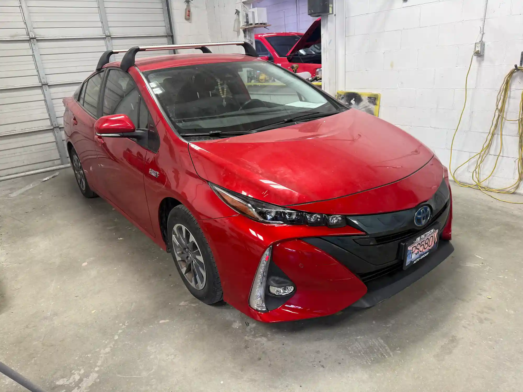 Red sedan after full restoration