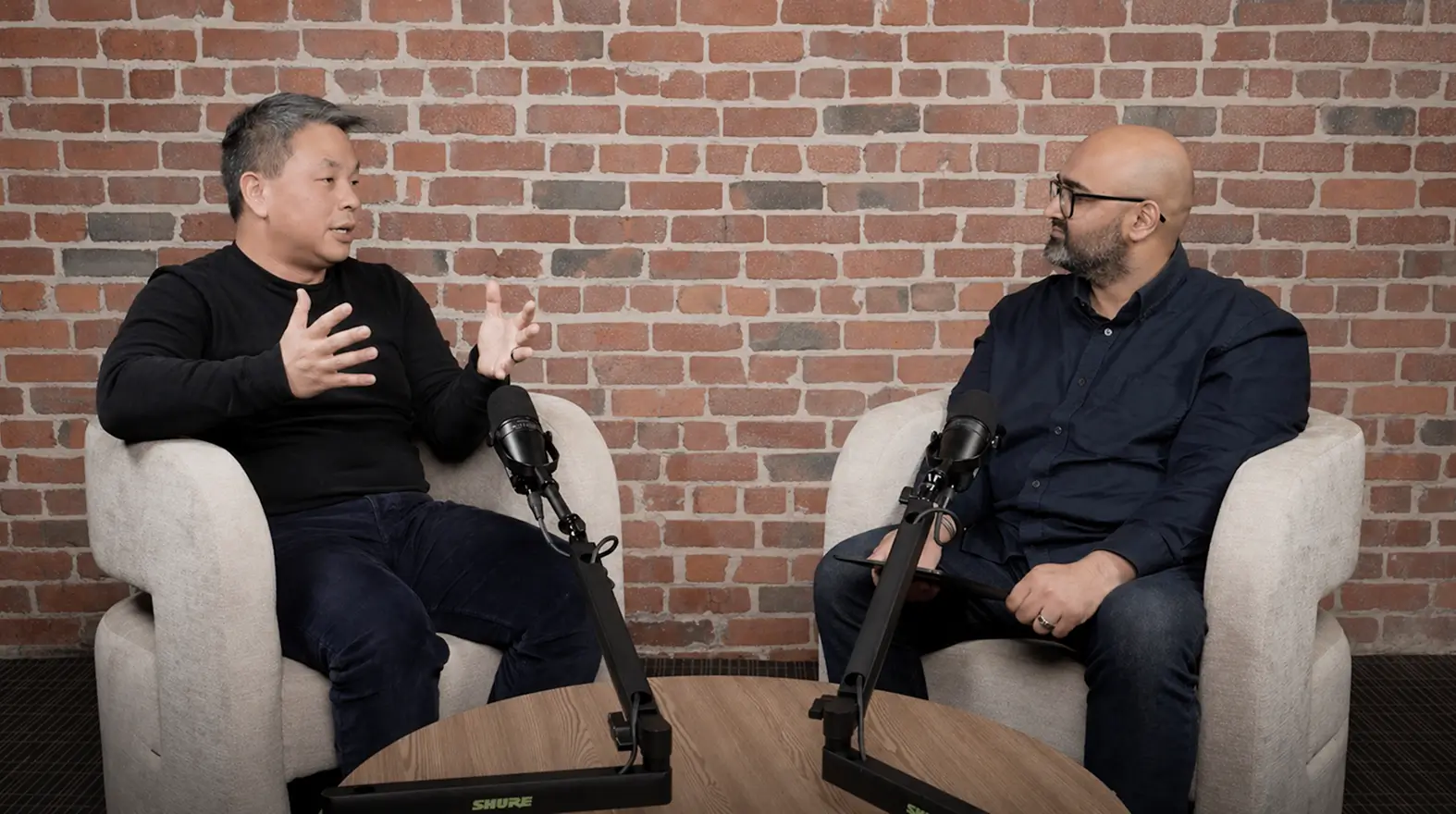 Two people speaking during an on-demand webinar
