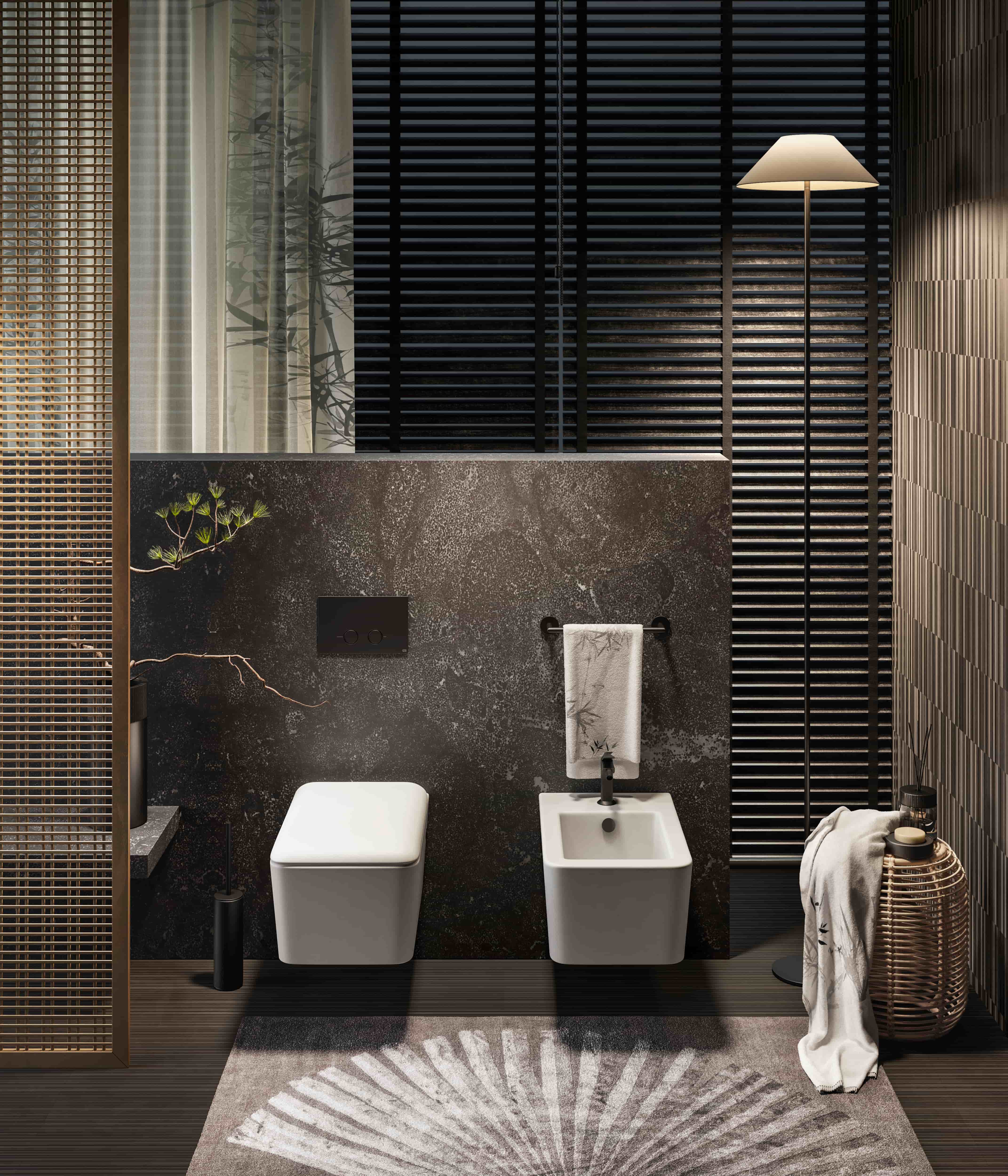 Gessi Ventaglio badkamer met wandcloset en bidet tegen een donkere stenen wand