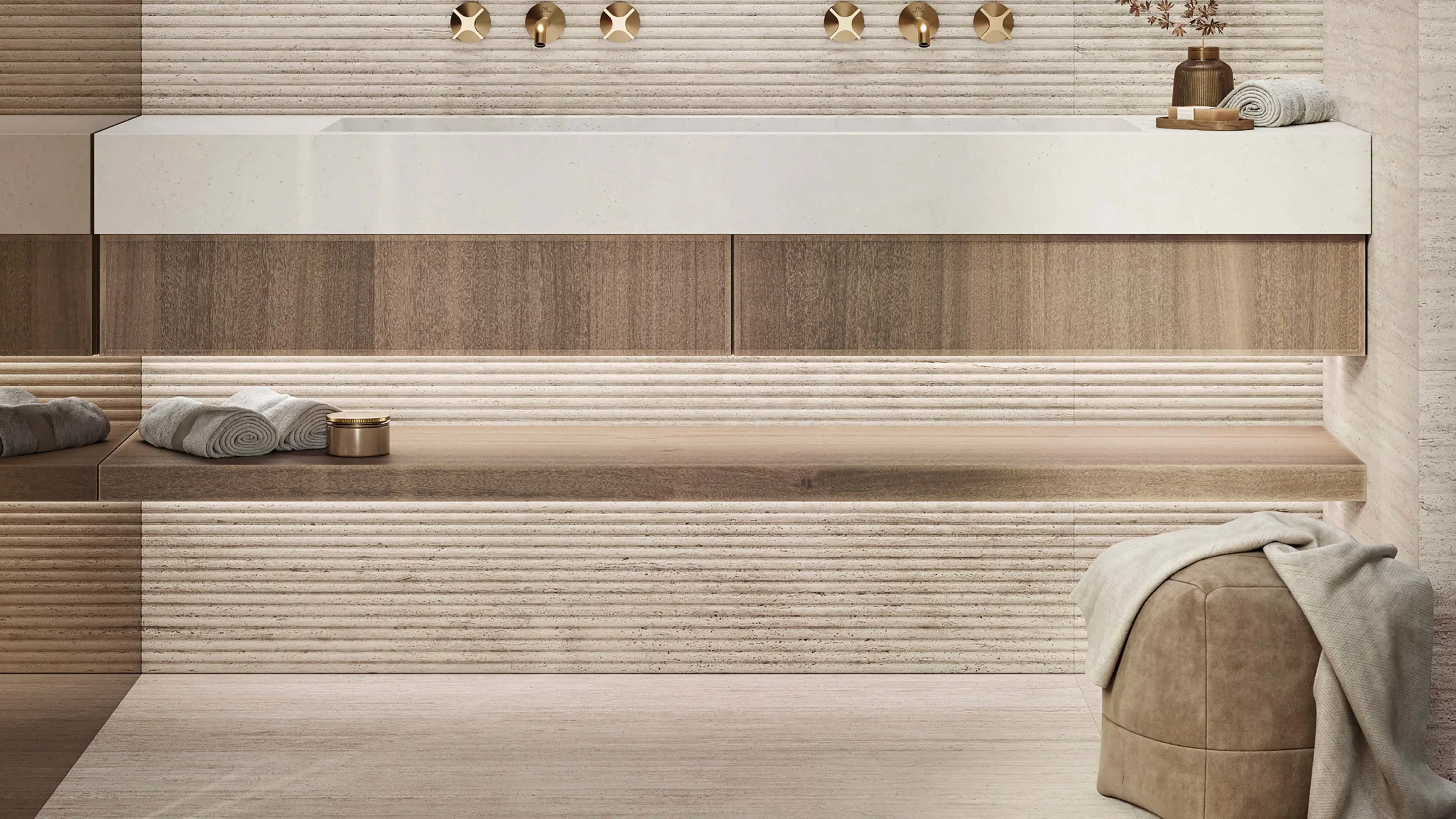 Porcelanosa Line Taranto Bone tegel in een badkamer met wastafelmeubel en gouden kranen