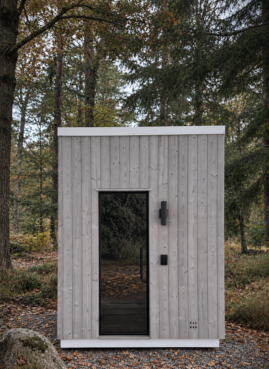 The Thorsby sauna at the edge of a forest in fall