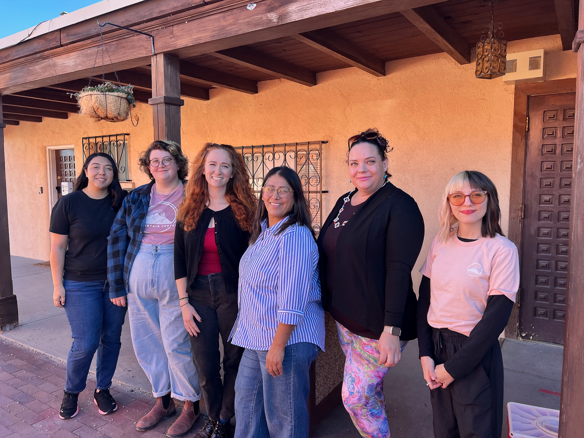 Six women standing outside The Mountain Center, Espanola Office
