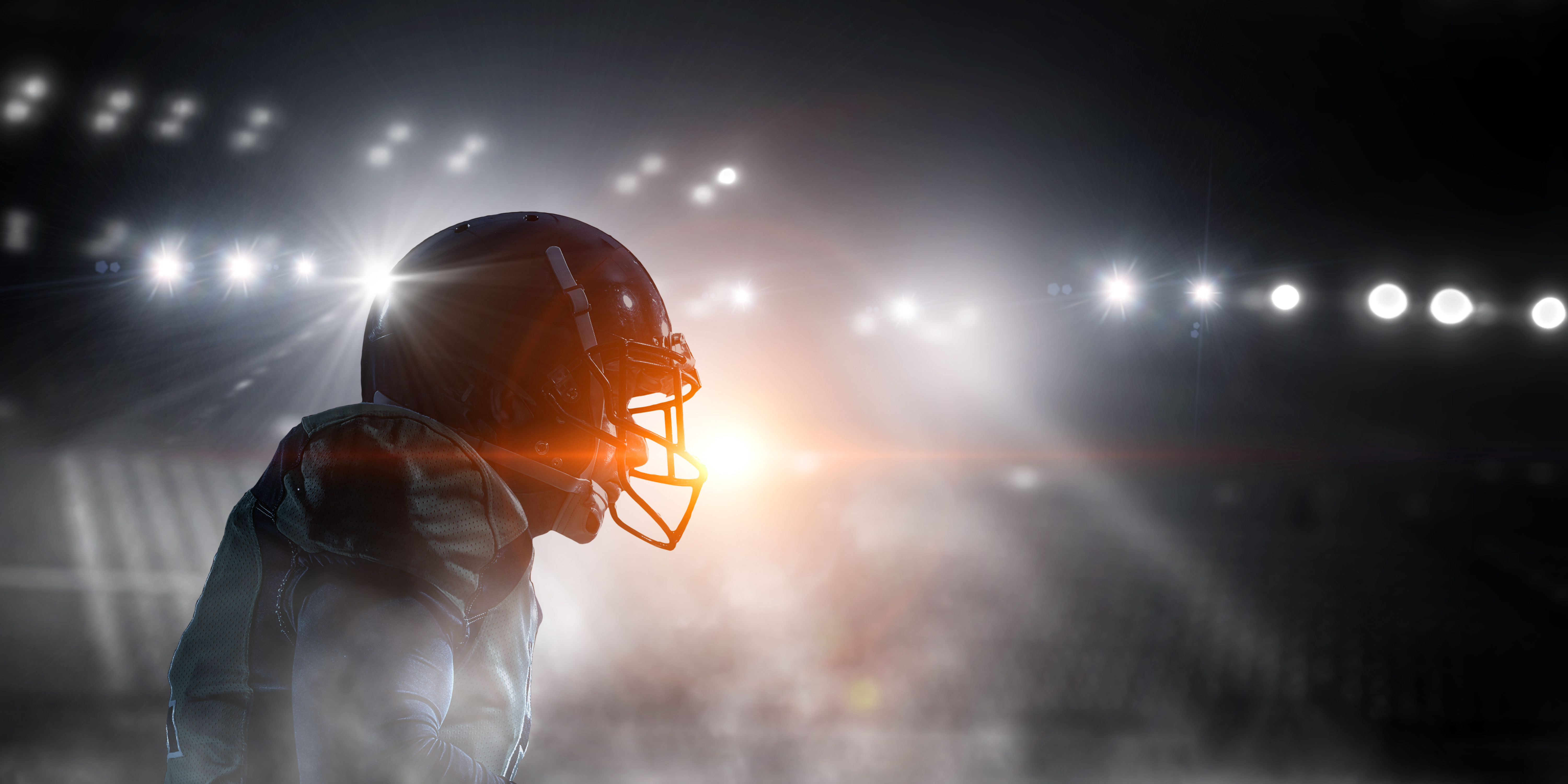 Football player under the lights