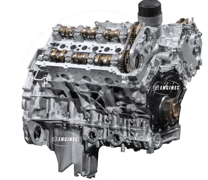 Silver and black Range Rover engine with visible camshafts and timing chain.