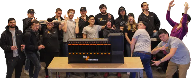TCG Machines silly company photo of staff and machine
