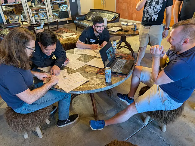 TCG Machines team members play a bomb defusing game