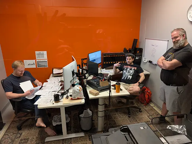 TCG Machines team members at work without shoes