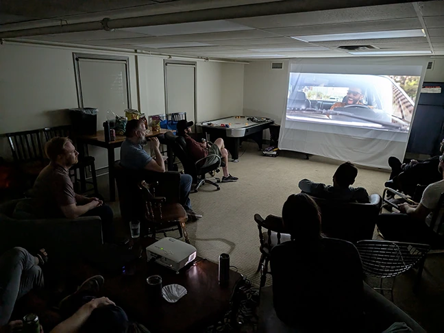 TCG Machines team watching The Unbearable Weight of Massive Talent