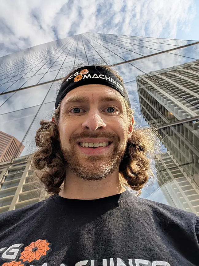 Graeme Gordon takes a selfie in front of the Brookfield Place building in downtown Calgary
