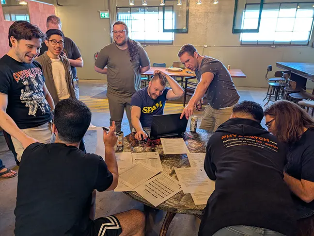 TCG Machines team members play a bomb defusing game