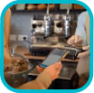 Customer holding a smartphone using mobile payment at a coffee shop counter with a barista preparing drinks in the background.