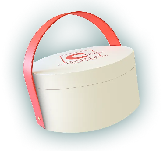 Oval-shaped cream-colored box with a red handle and a red logo on the lid.