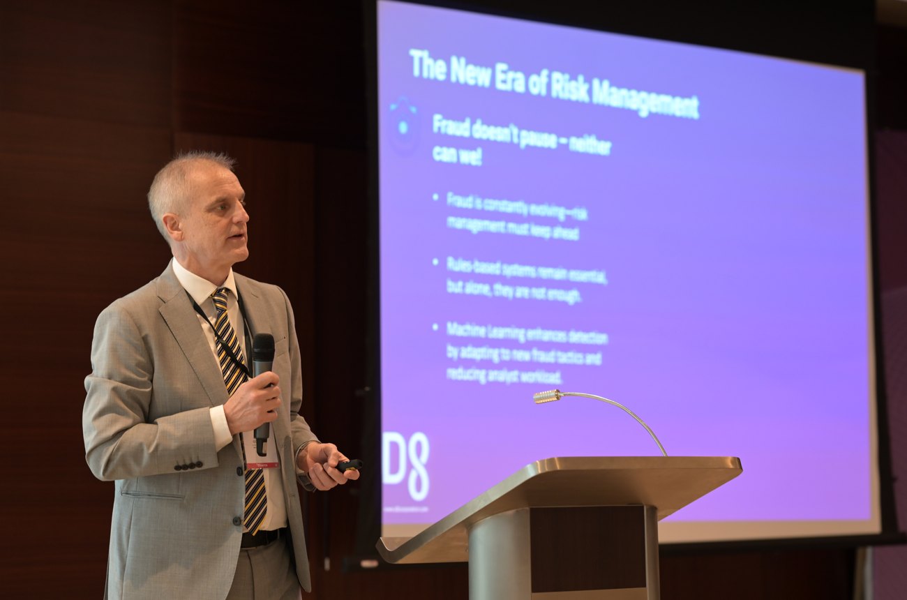 Speaker presenting on stage at a PMG Events summit