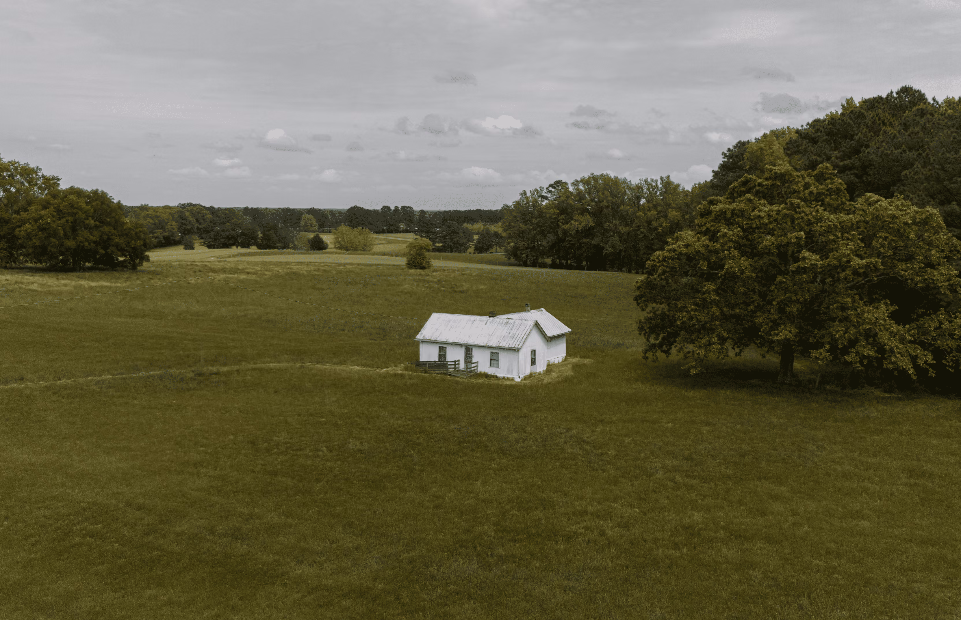 tiny home on vacant land - aerial view of a small off-grid property in a rural area