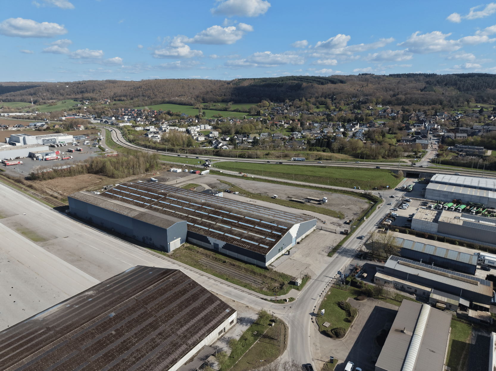 image of a modern eco-friendly building with integrated renewable energy systems