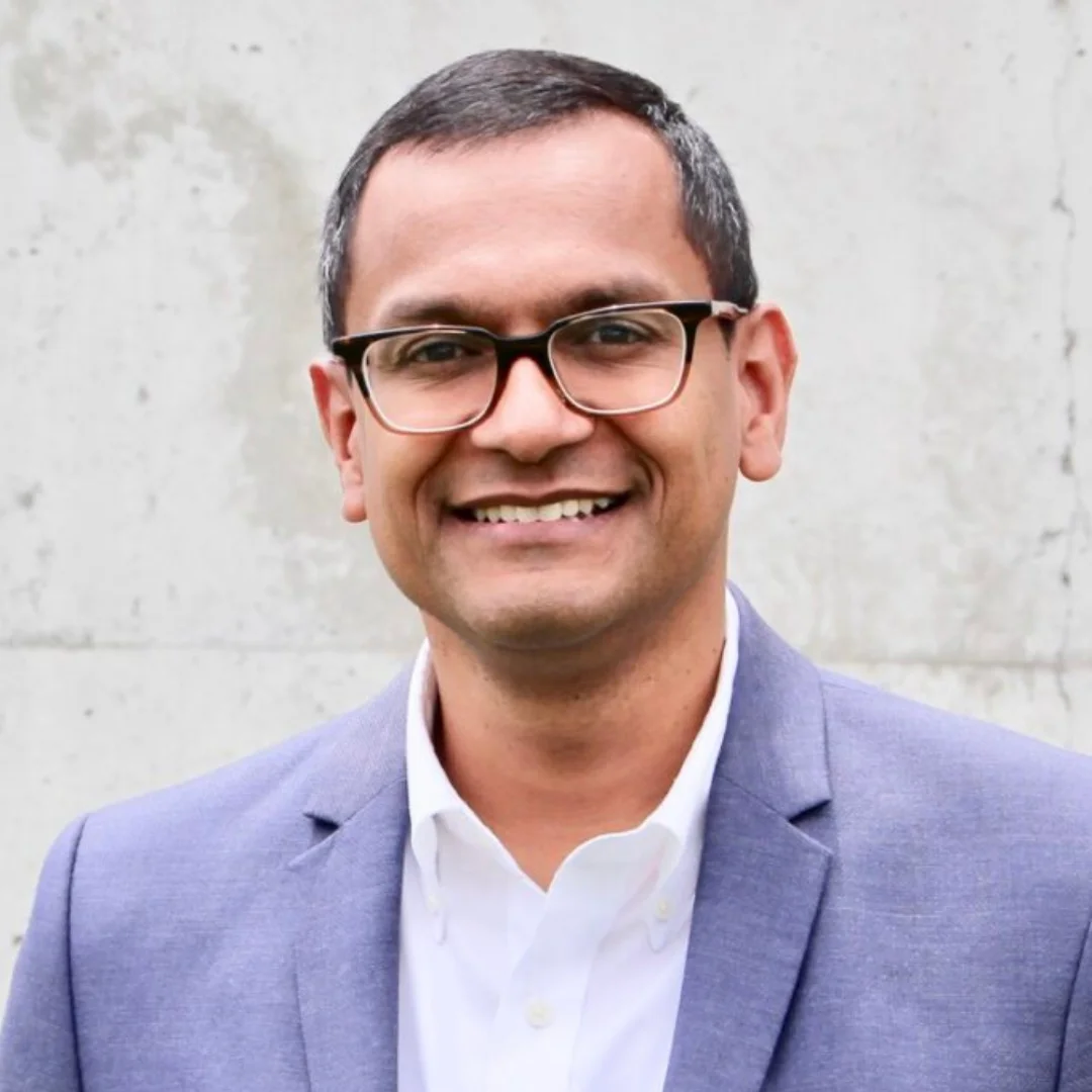Male speaker headshot — man in blue blazer and glasses — book with PepTalk