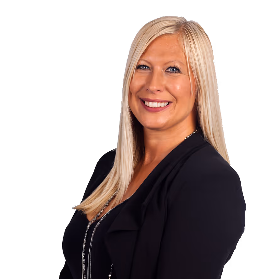 Smiling woman with long blonde hair wearing a black jacket against a black background.