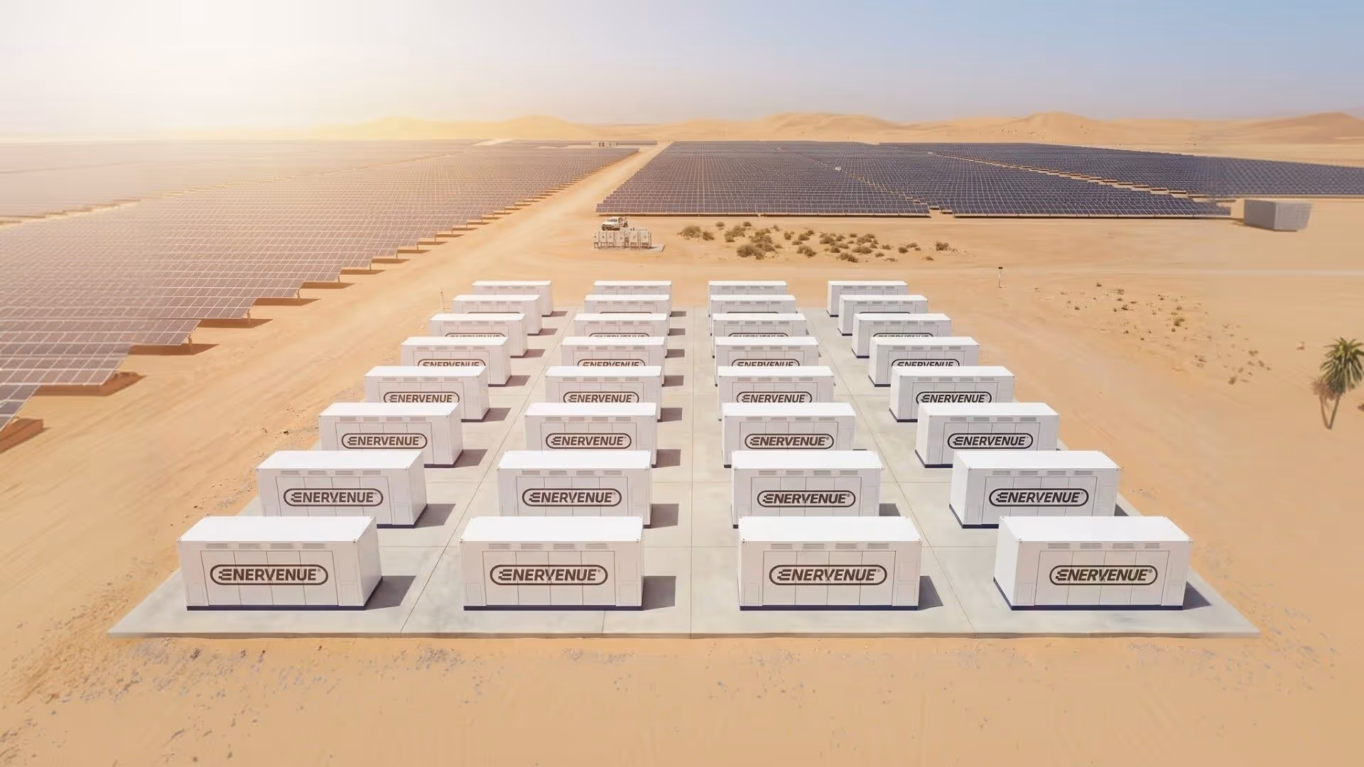 Aerial view of EnerVenue energy storage units deployed alongside a large-scale solar farm in a desert landscape