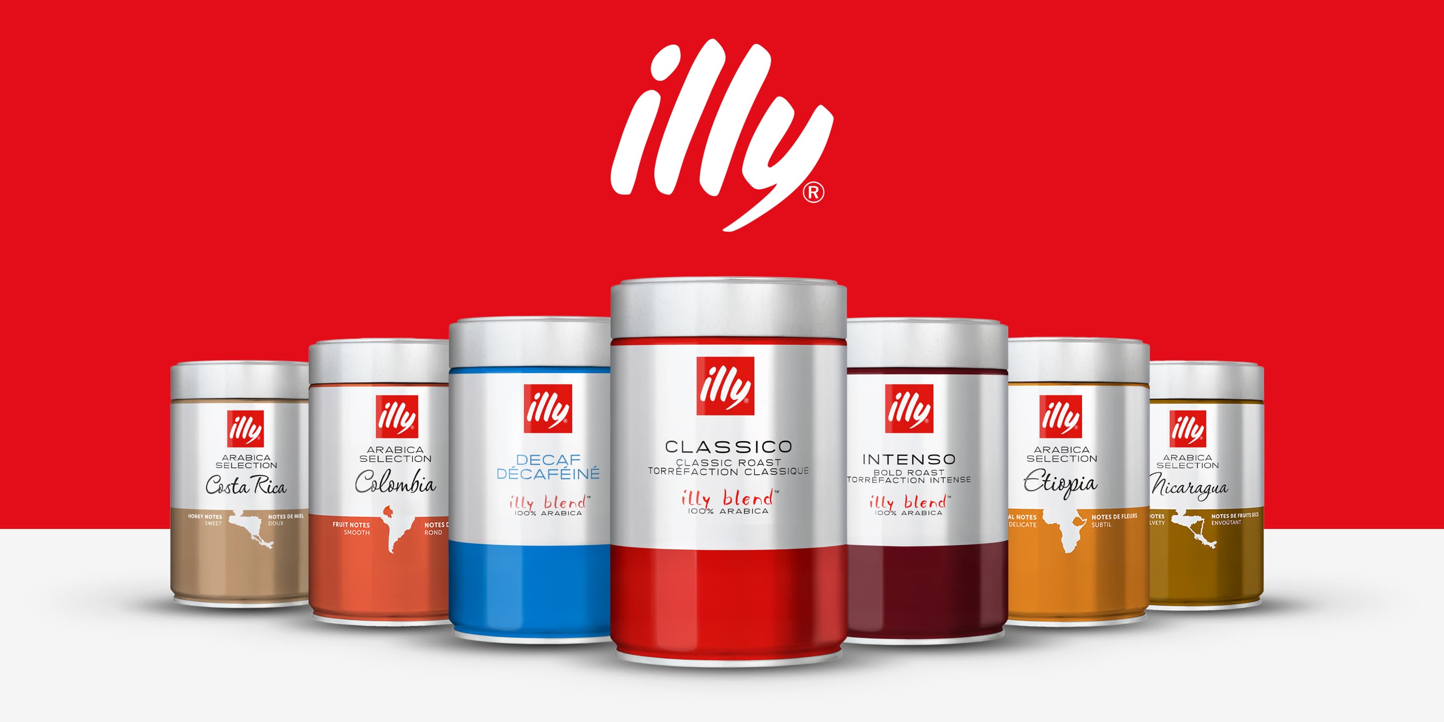 illy brand hero image on a red background featuring seven color-coded ground coffee tins lined up — Costa Rica (gold), Colombia (orange), Decaf (blue), Classico (red), Intenso (burgundy), Etiopia (amber), and Nicaragua (yellow) — with the illy logo prominently displayed above.