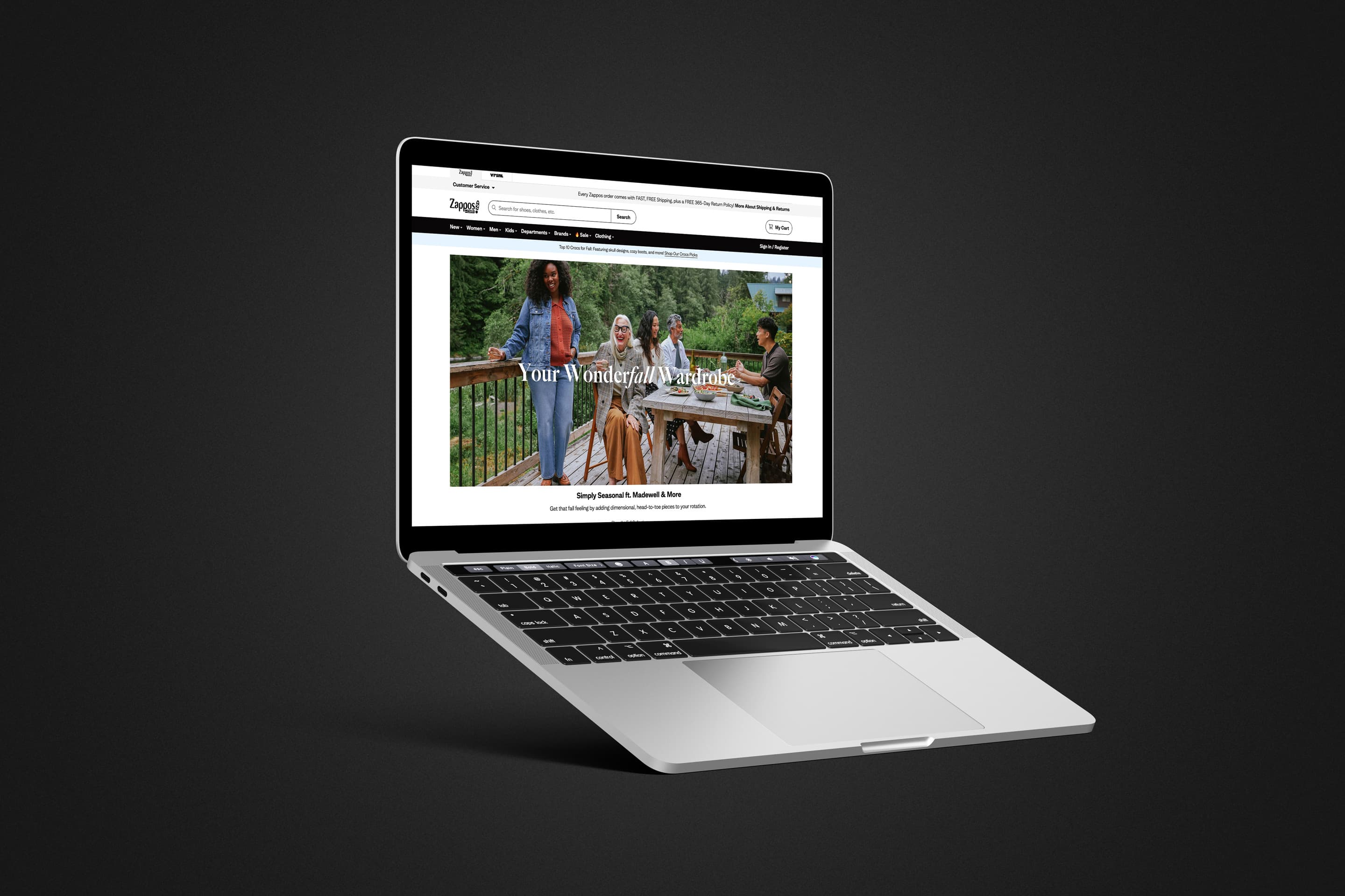 Zappos.com homepage on a laptop showing the "Your Wonderfall Wardrobe" fall campaign hero.