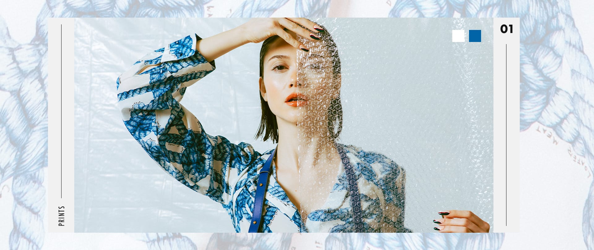 VRSNL editorial image art directed by Alex Mera for the "Prints" story — a model in a blue rope-print shirt is half-veiled by bubble wrap, styled against a matching printed backdrop with bold graphic numbering.