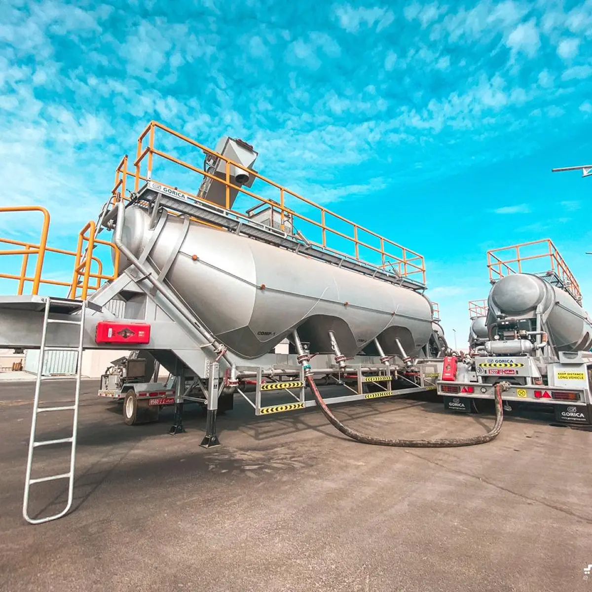 Bulk cement tanker trailers under a blue sky