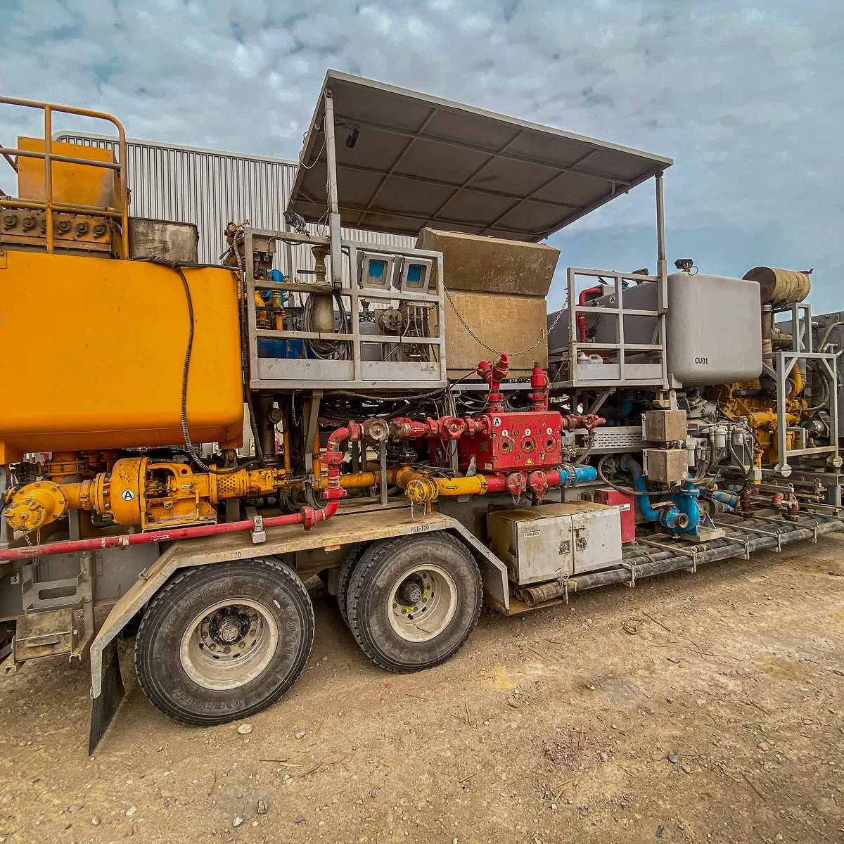 Cementing unit with mixing equipment set up in the field