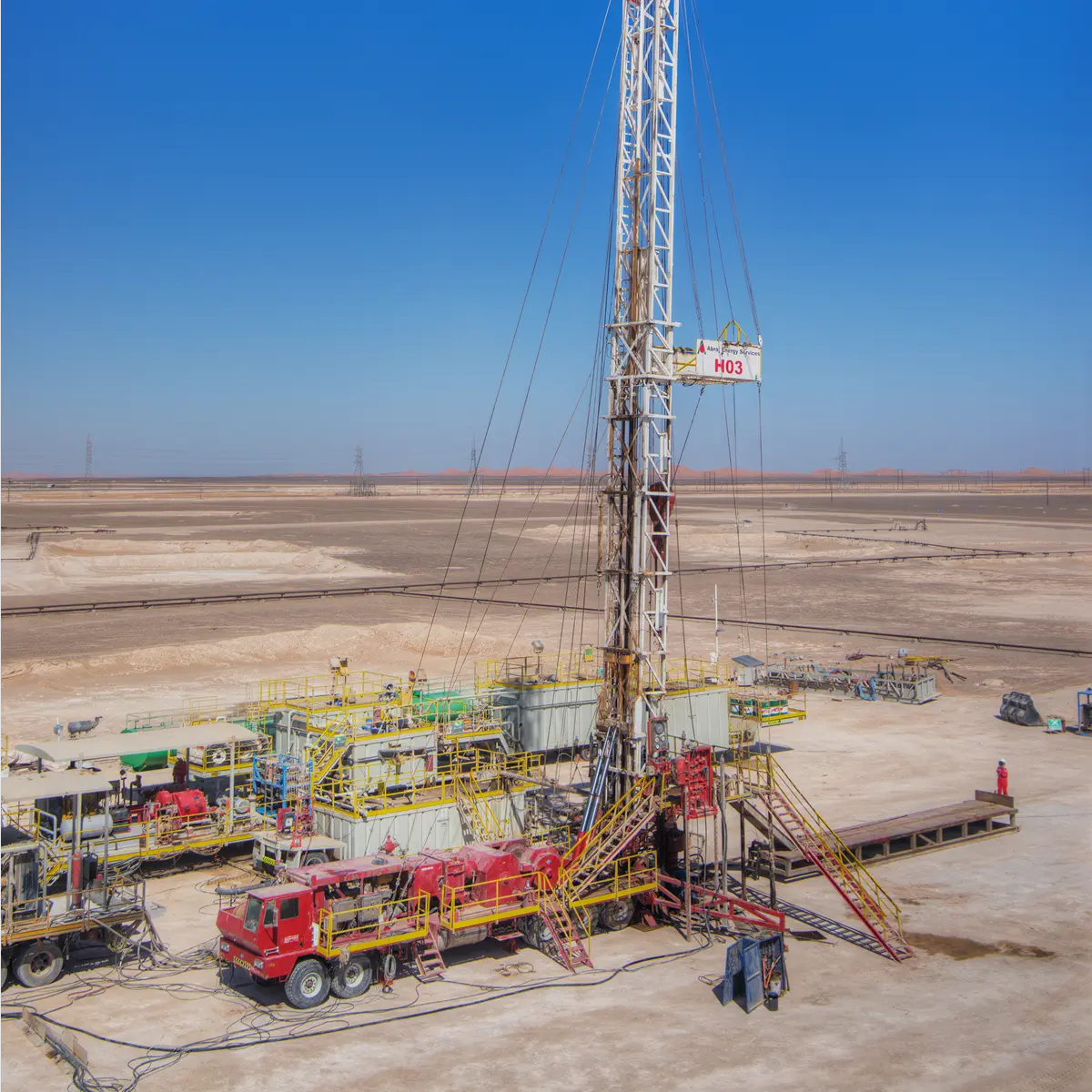 Workover rig operating at a desert wellsite