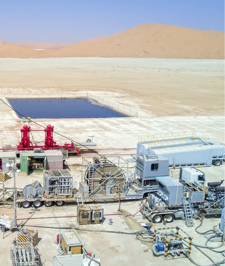 Aerial view of a matrix acidizing operation with red manifold