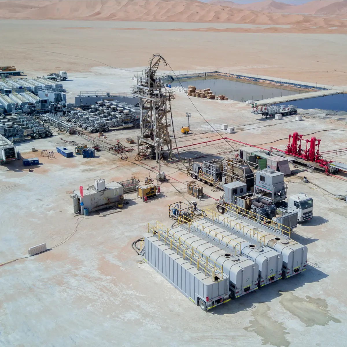 Aerial view of an acid chemistry facility with storage tanks