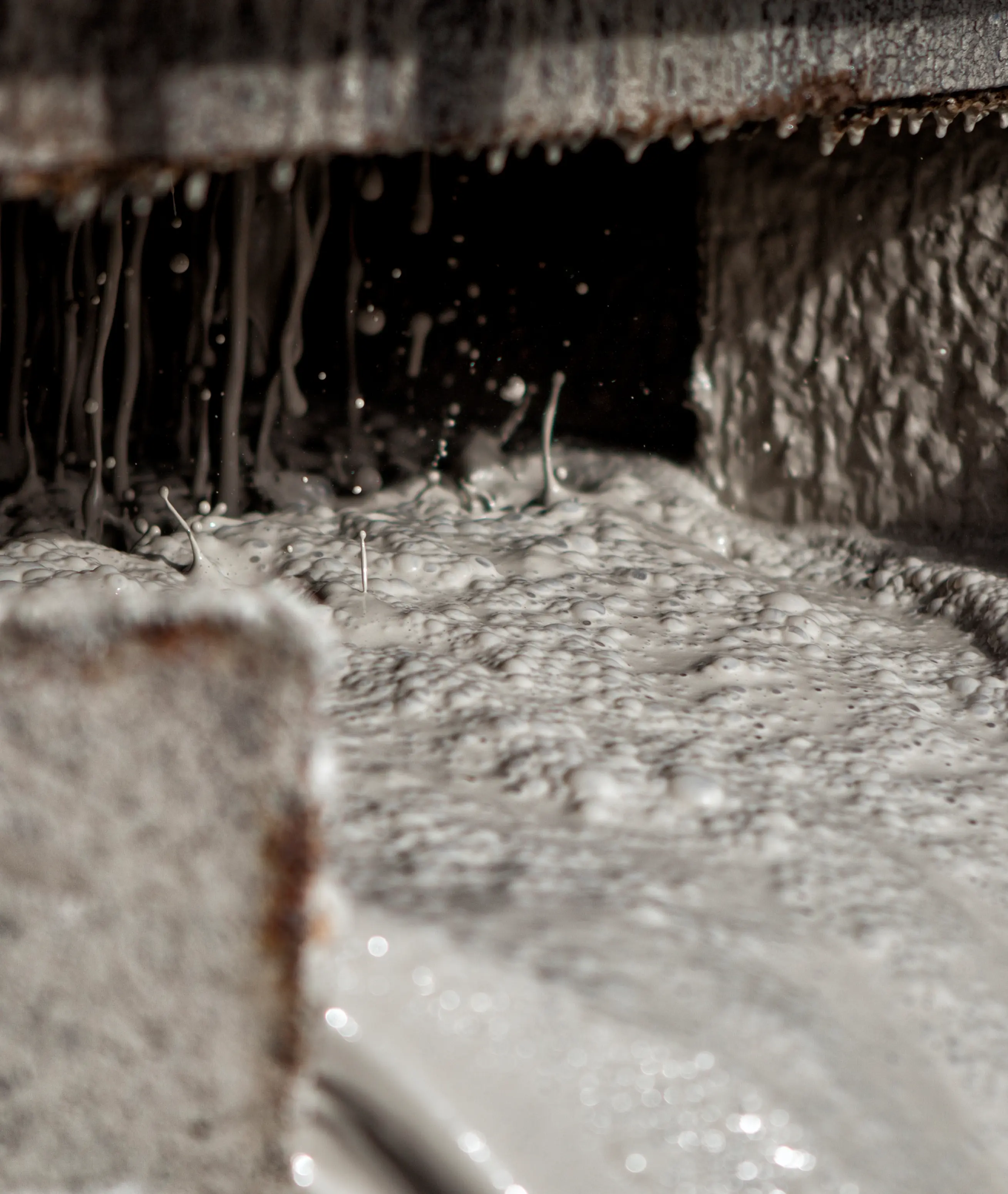 Drilling fluid flowing over a shale shaker screen