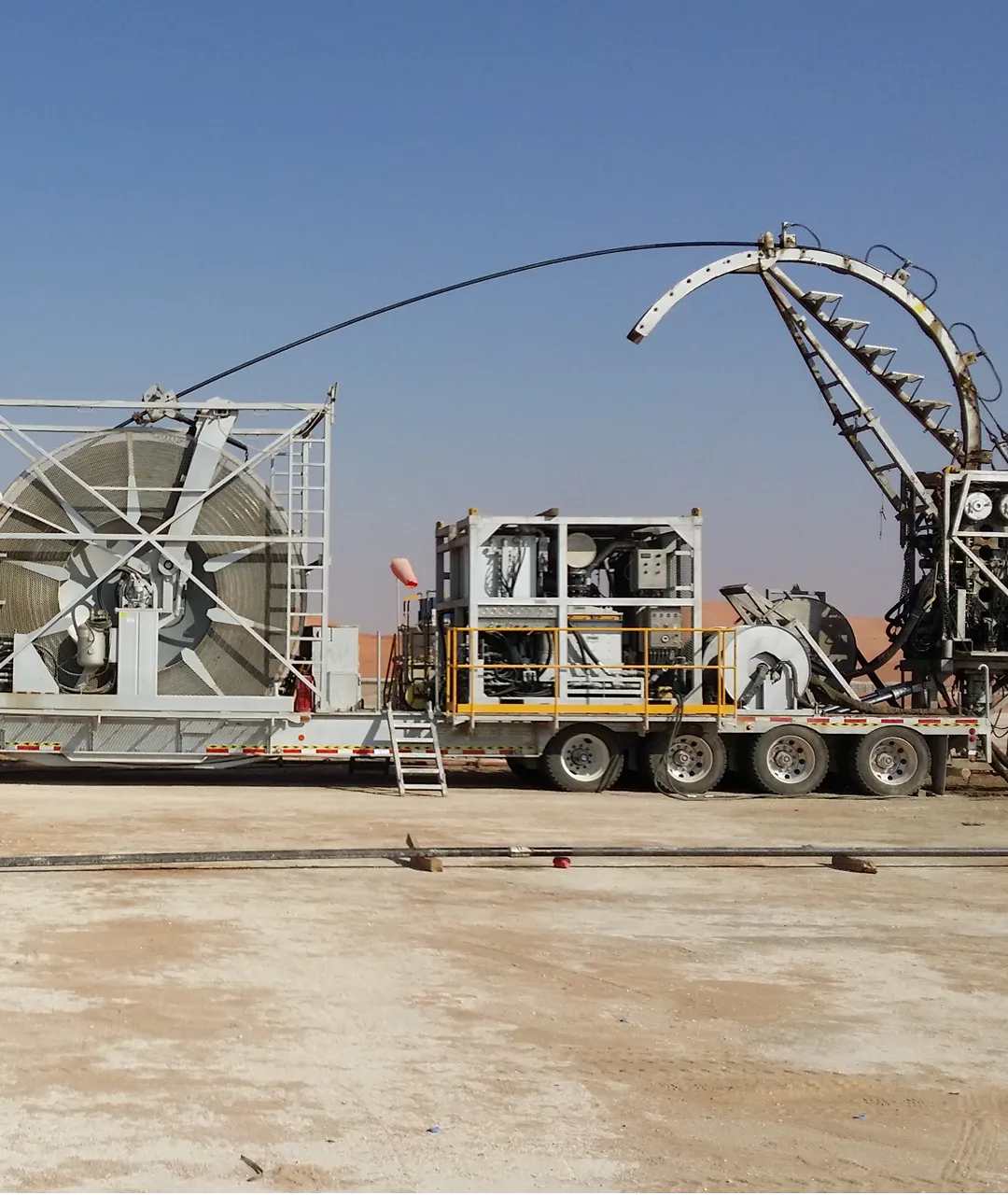 Coiled tubing unit with reel and injector arch on location