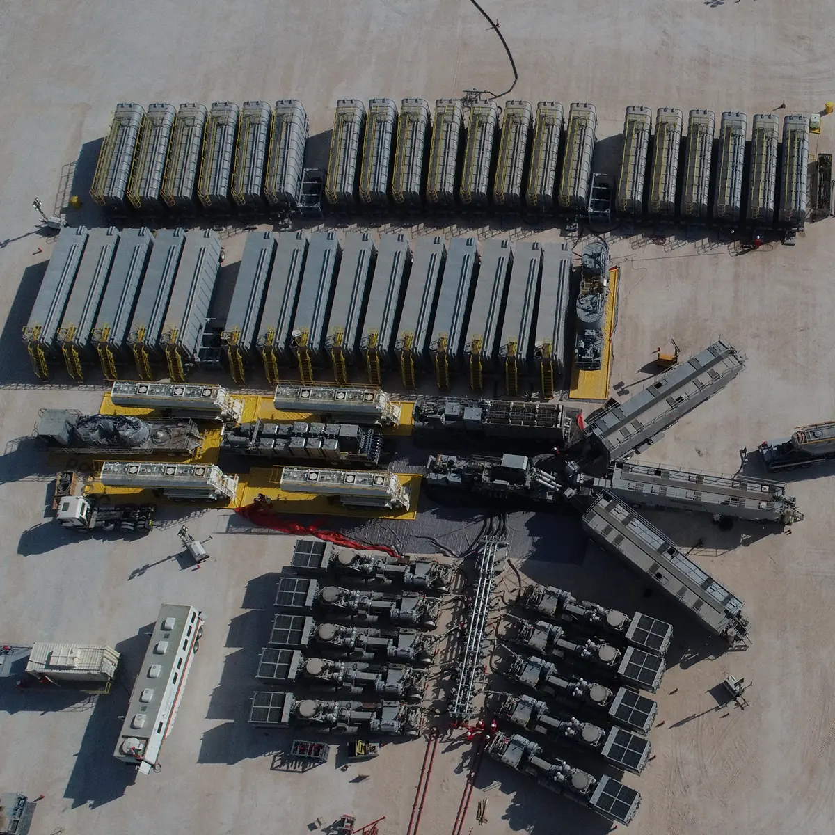 Overhead view of a hydraulic fracturing fleet laid out on location