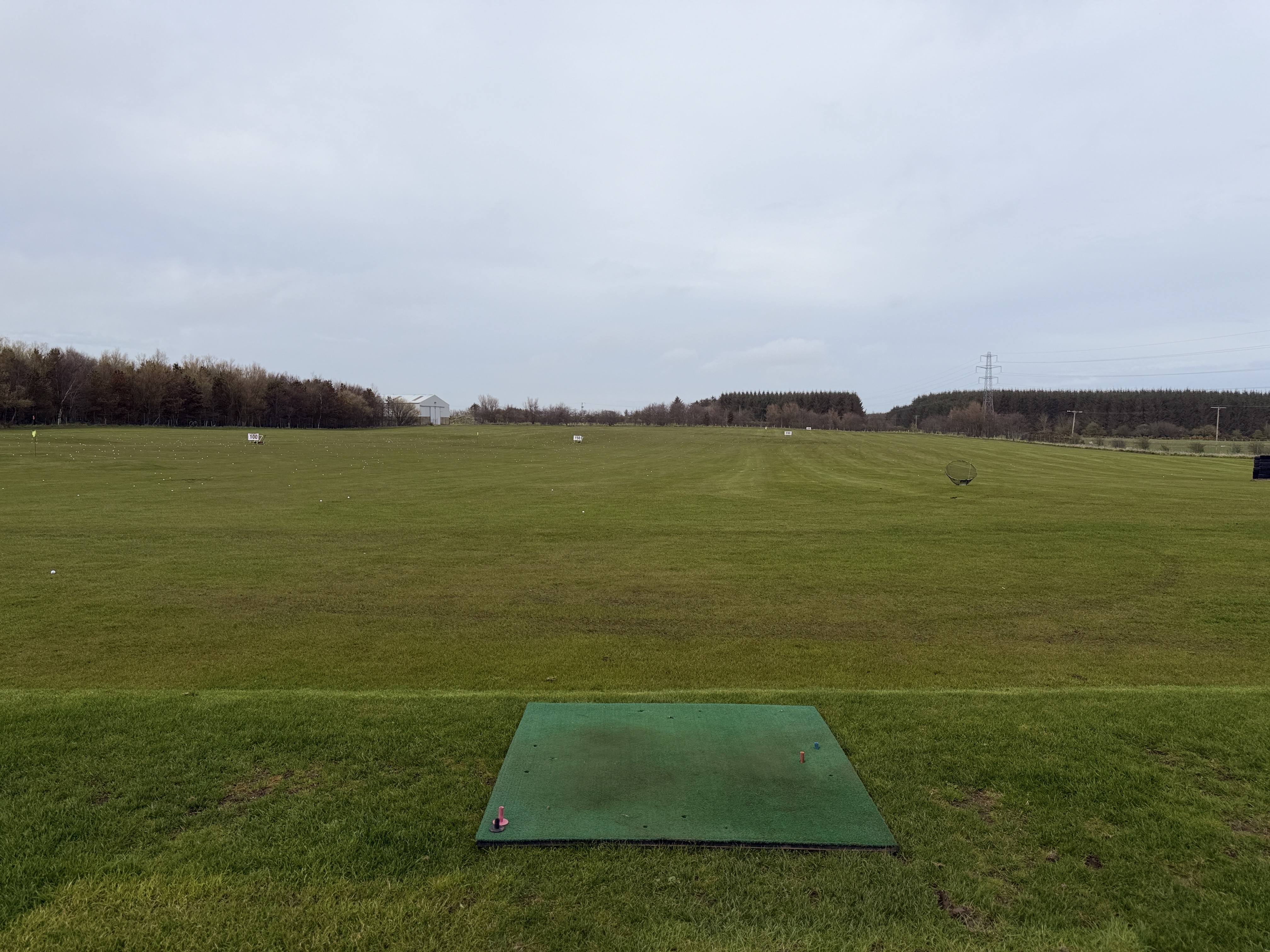 Grass practice area with hitting mat at Berryhill Golf Range Peterhead