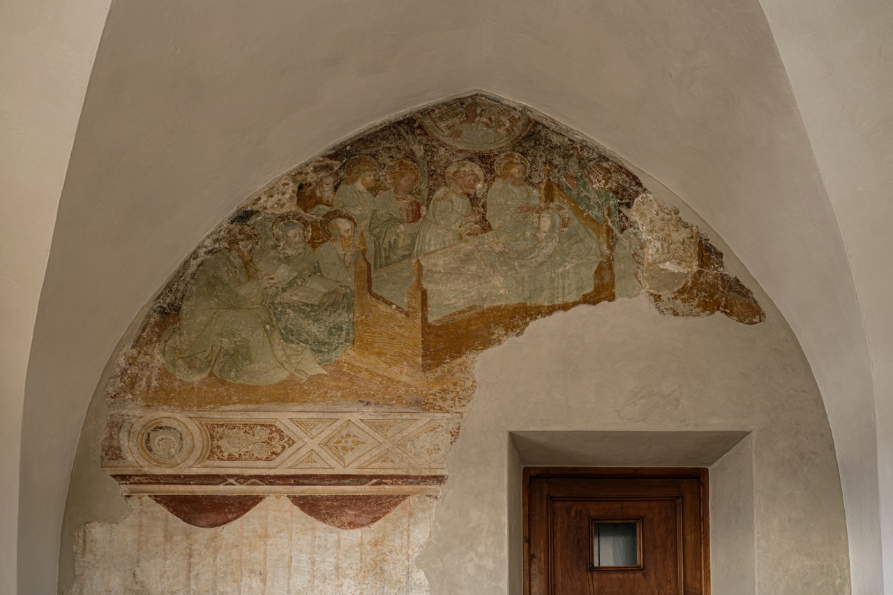 Romanesque fresco above a doorway at Castel Badia