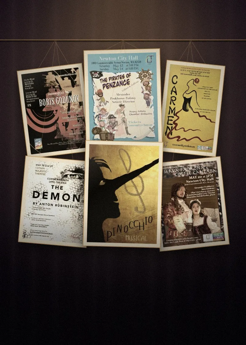 Posters from past Commonwealth Lyric Theater productions hanging under a spotlight