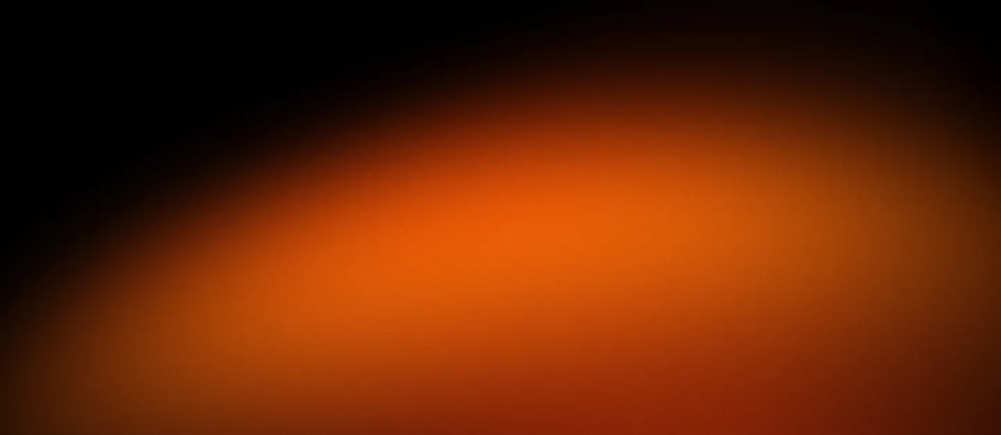 Gradient background transitioning from dark black to bright orange.