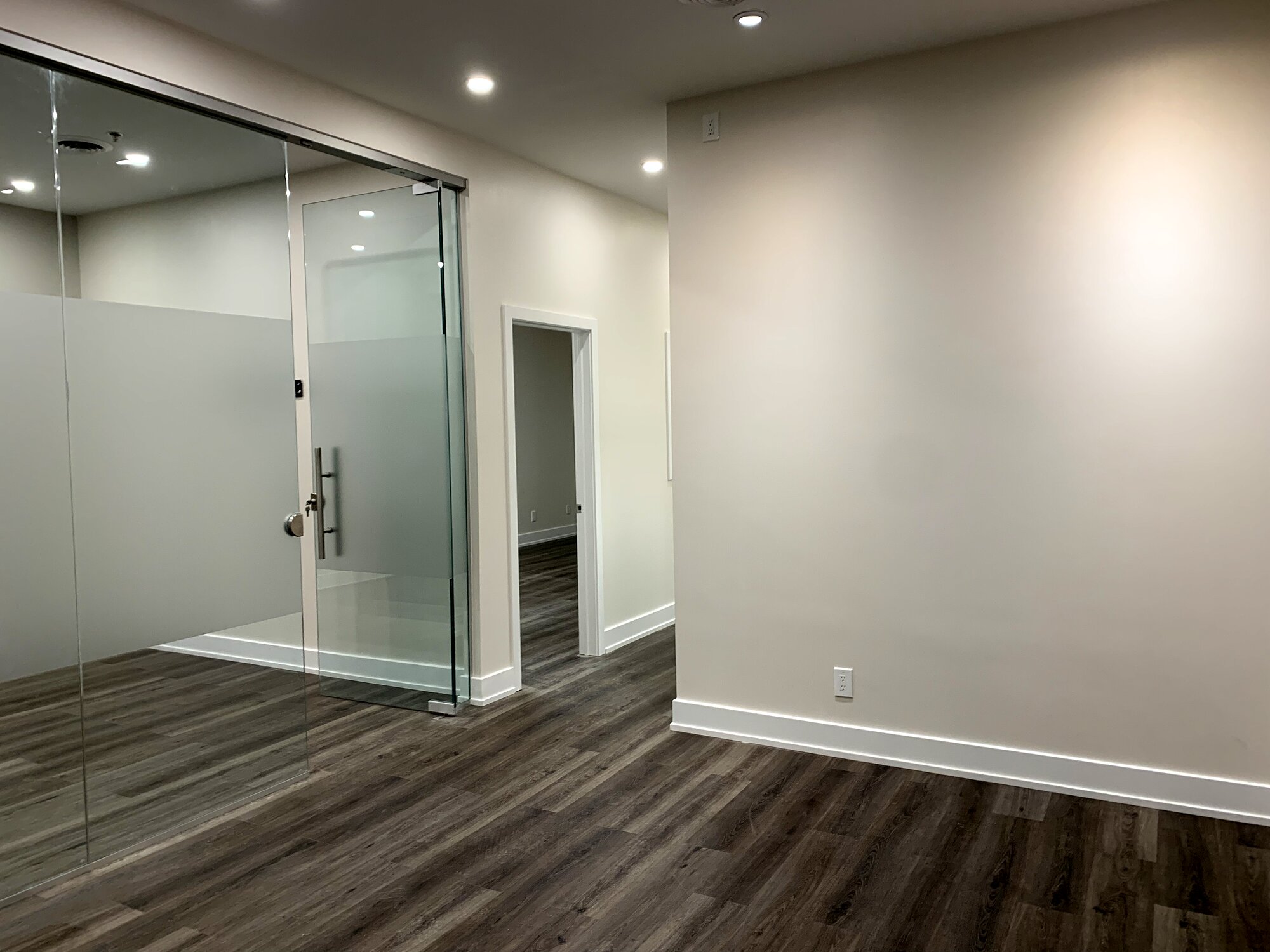 Frameless glass entry door and demised commercial unit completed as landlord's work in the GTA