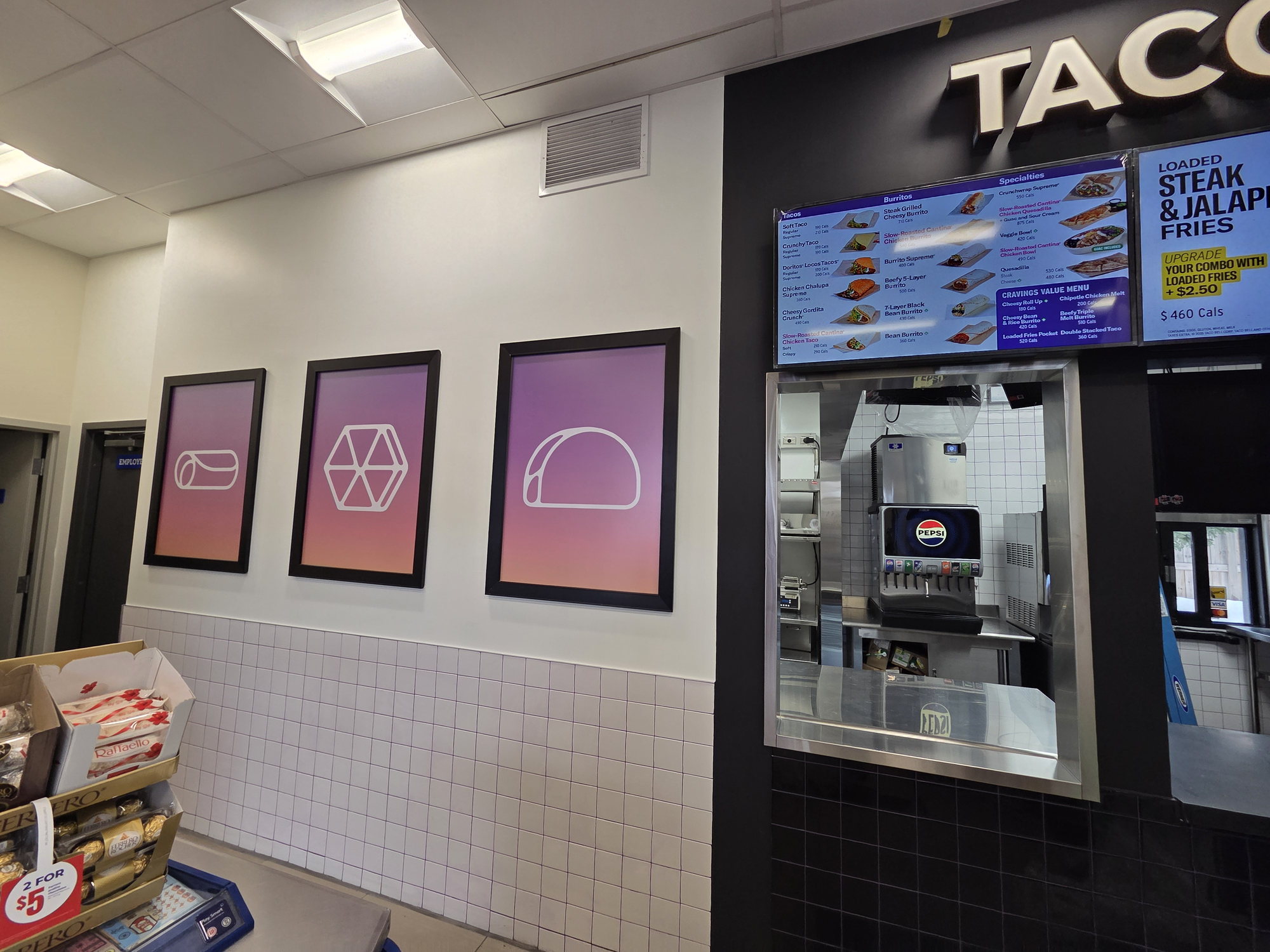 Brand graphics wall and menu board in a completed gas station quick-service restaurant build-out in Vaughan
