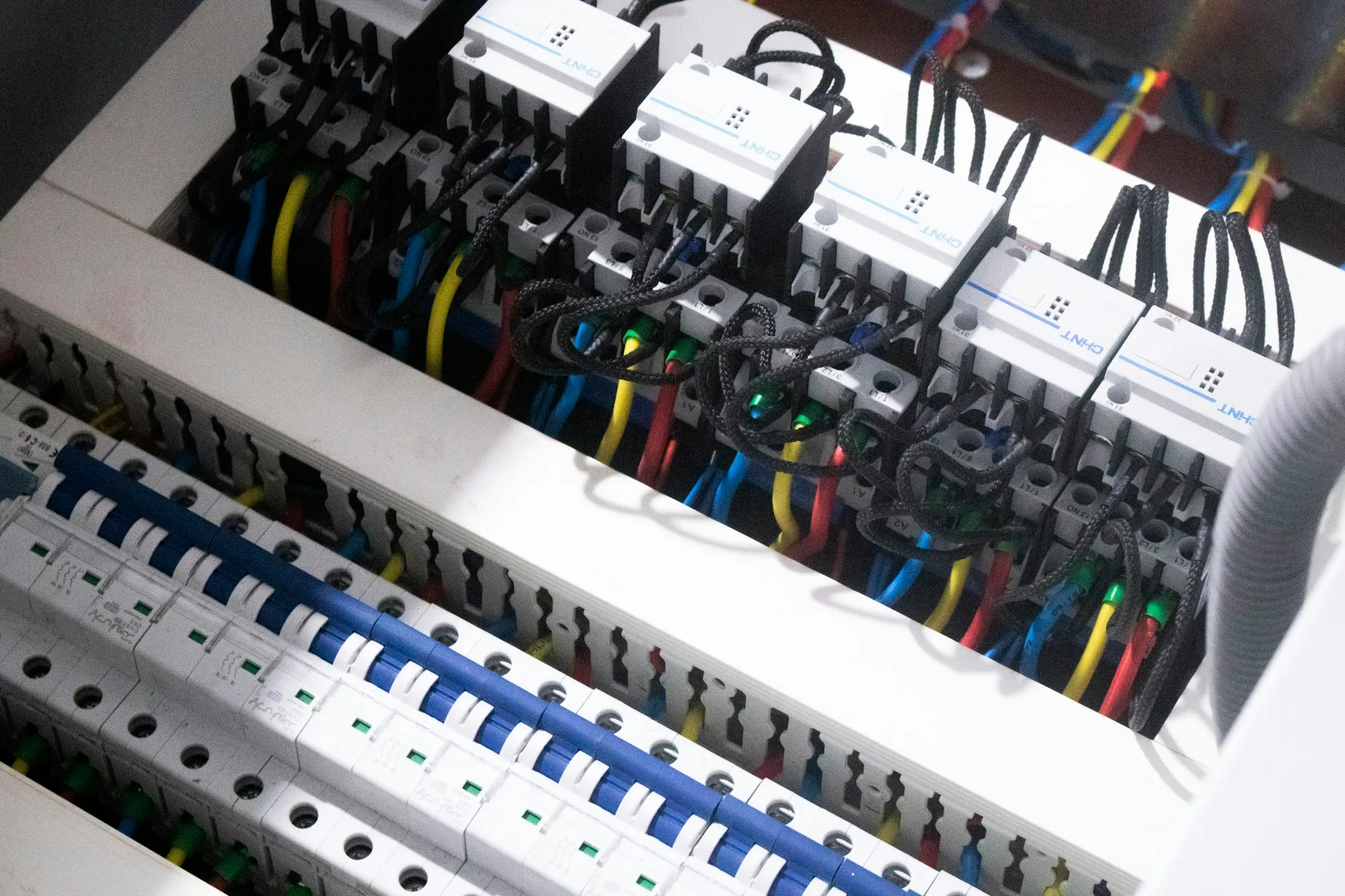 Electrical distribution panel wiring terminated during electrical rough-in on a commercial fit-out