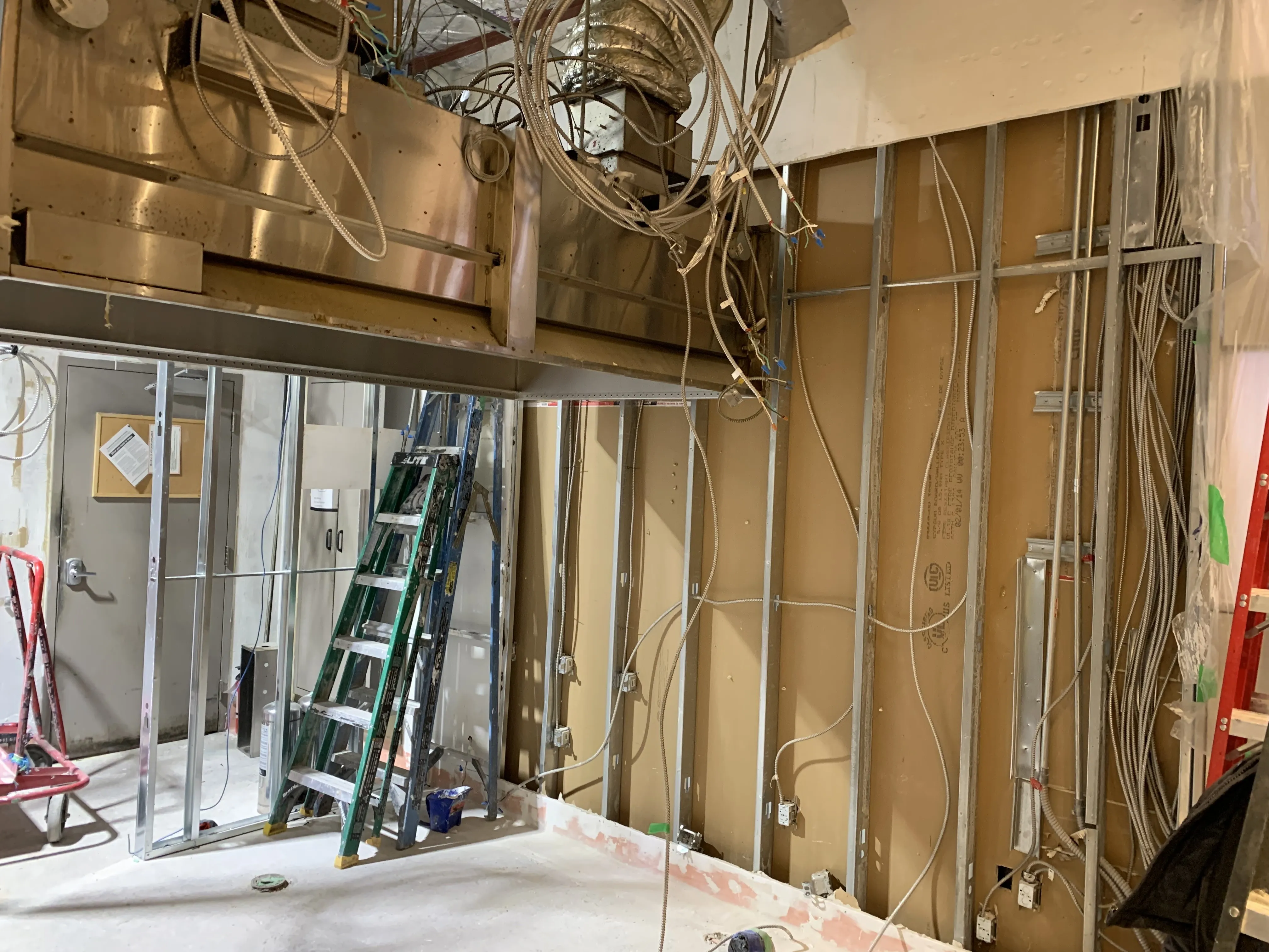 Coordinated ductwork, electrical and plumbing rough-in above an open ceiling, GTA build-out