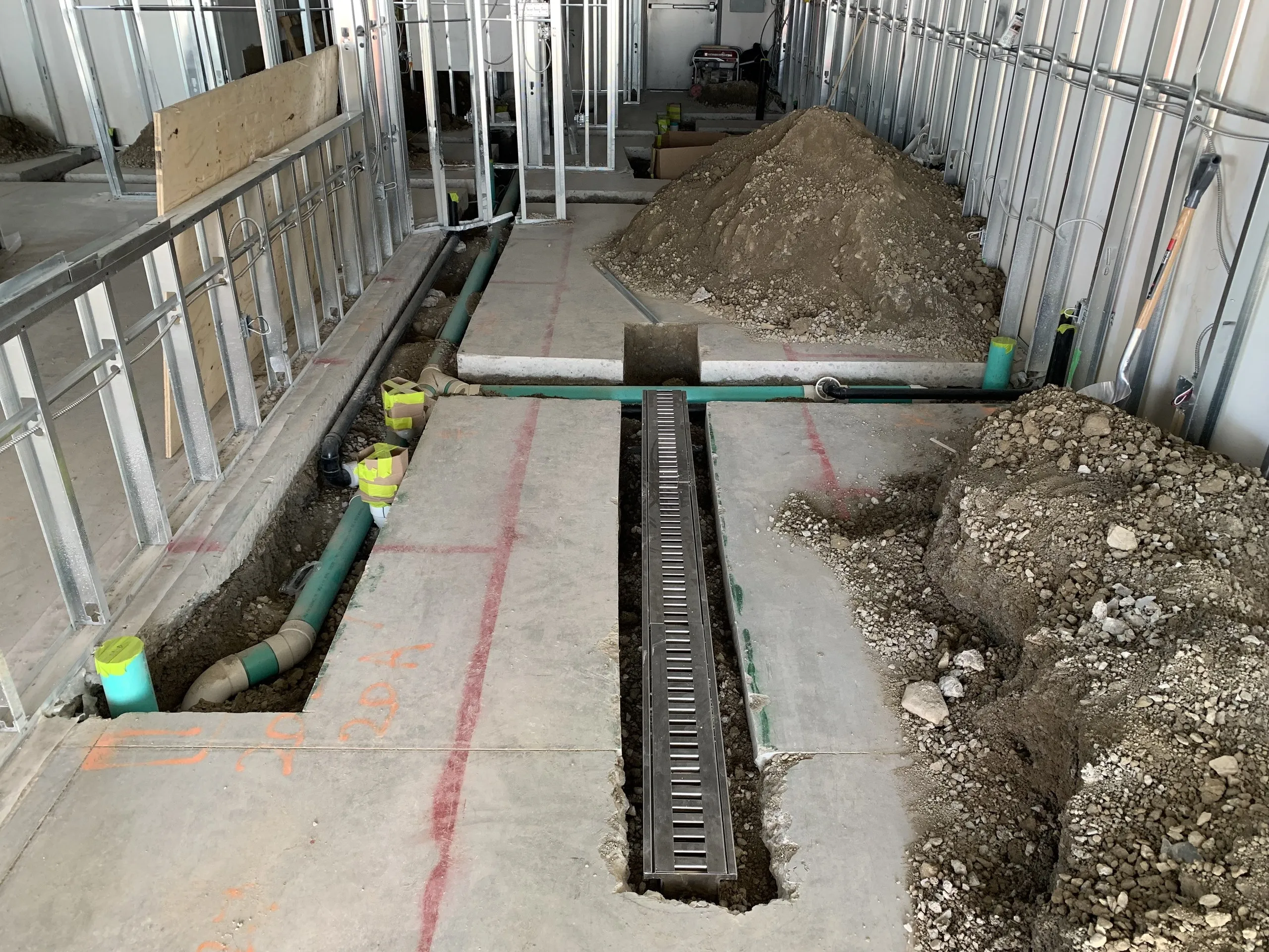 Underground plumbing and services rough-in during a restaurant build-out in Toronto