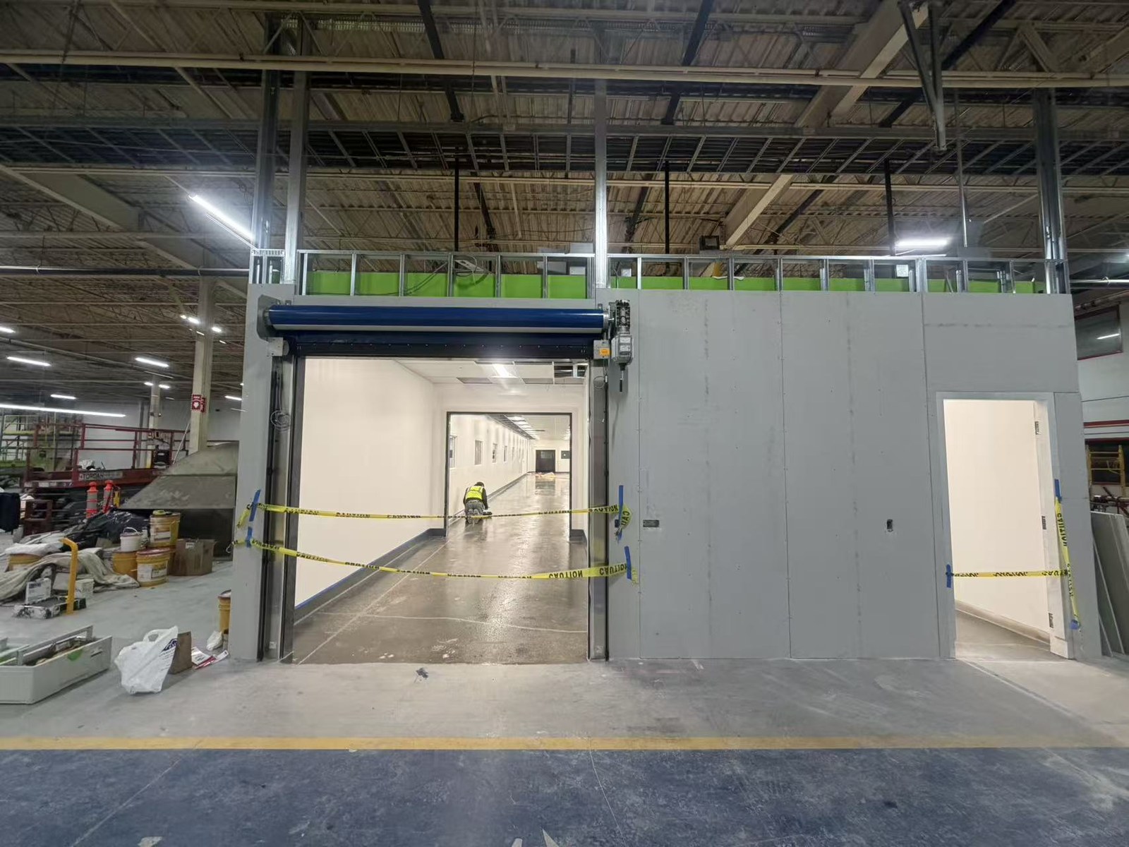 Cleanroom partition wall framing opening into the finished production hall