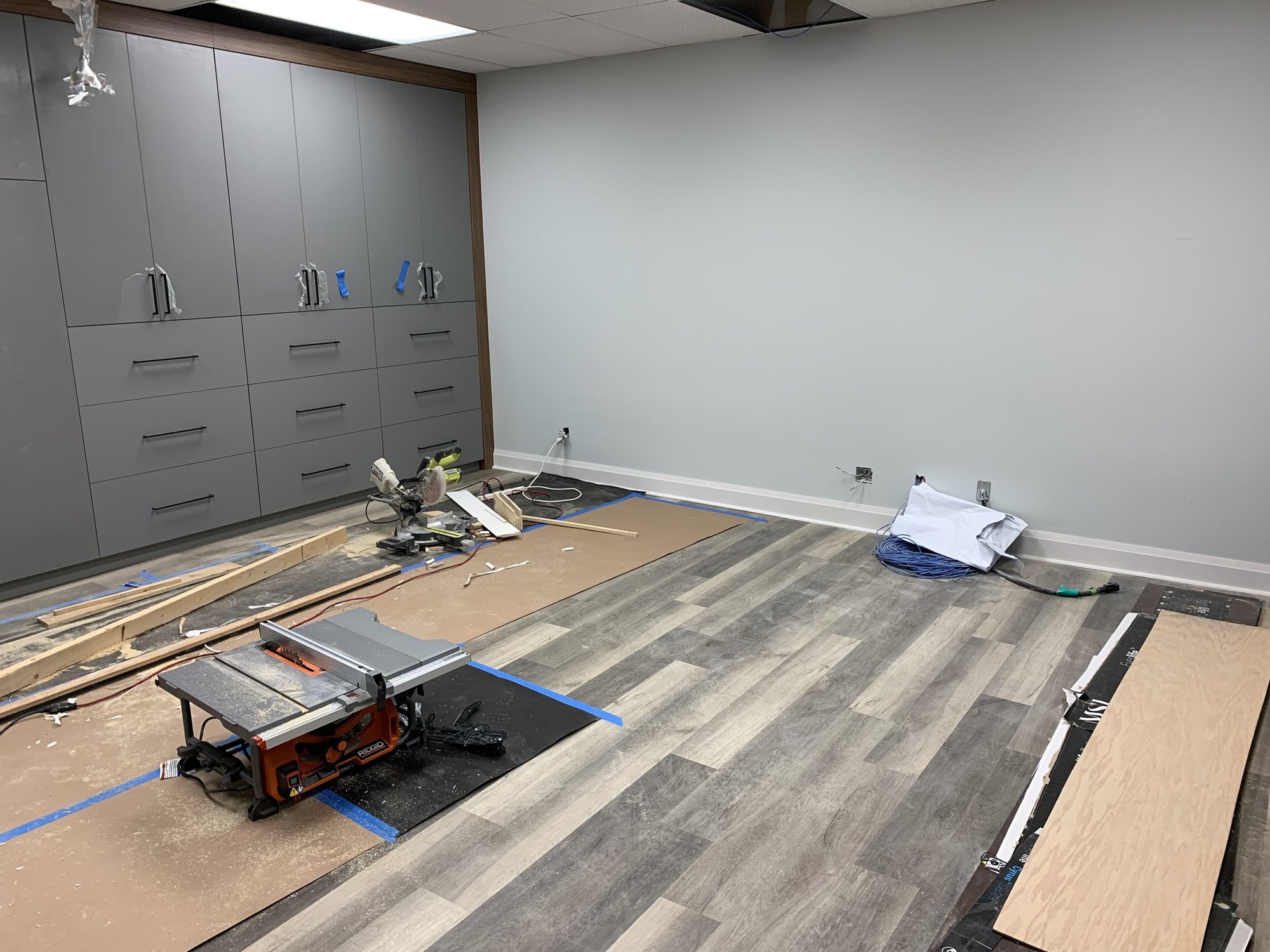 Luxury vinyl plank flooring installation in progress during a 2,000 sf office fit-out in Richmond Hill
