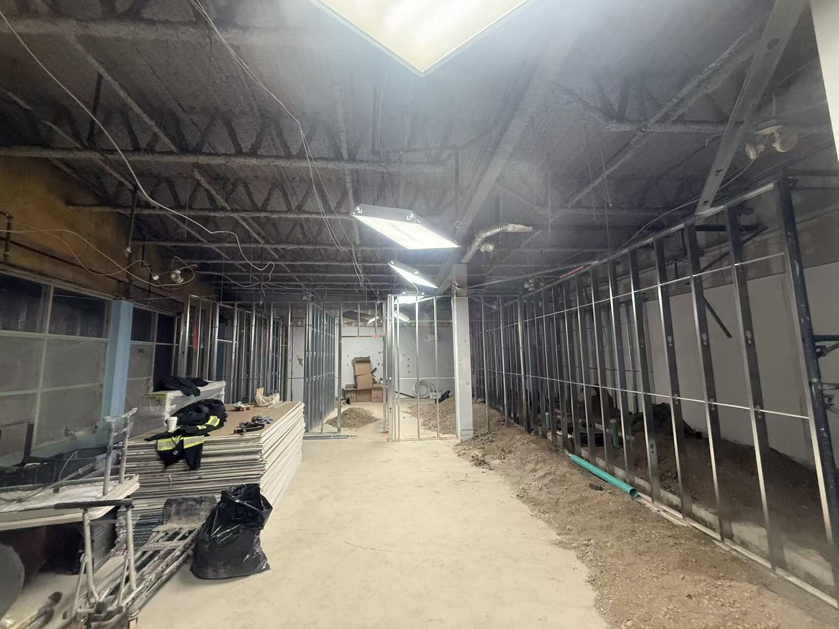 Steel stud framing through the back-of-house of a quick-service restaurant build-out in Toronto