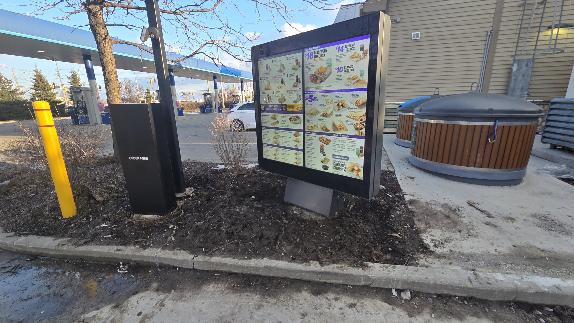 Digital drive-thru menu board installed on the forecourt of a Vaughan gas station