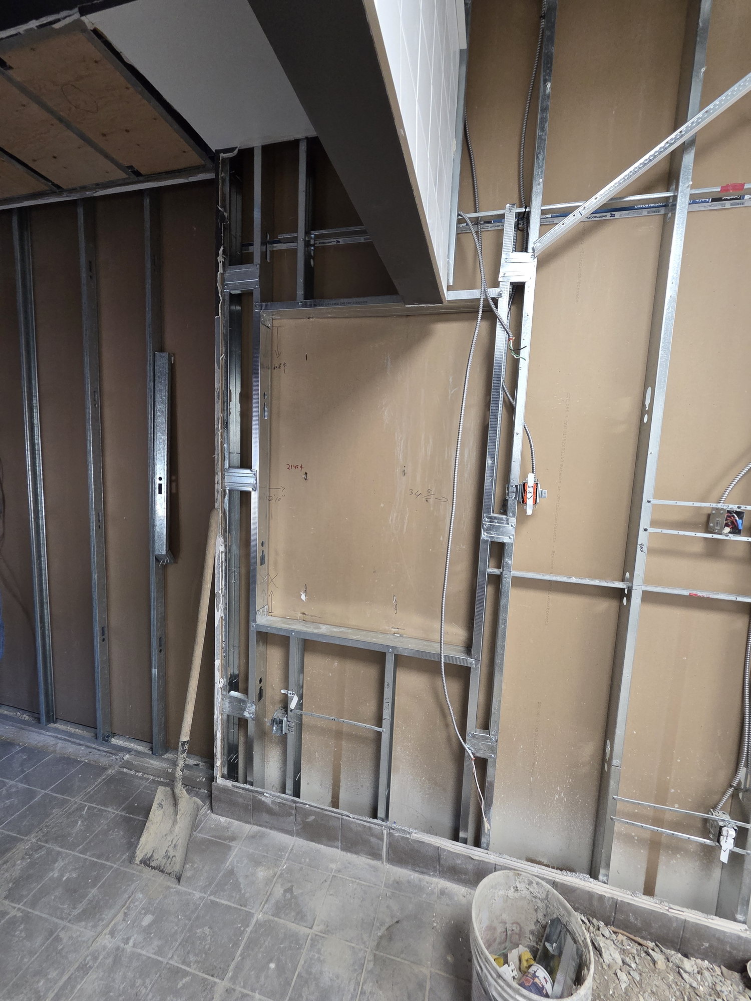 Steel stud partition framing in the back-of-house during a Vaughan gas station QSR build-out