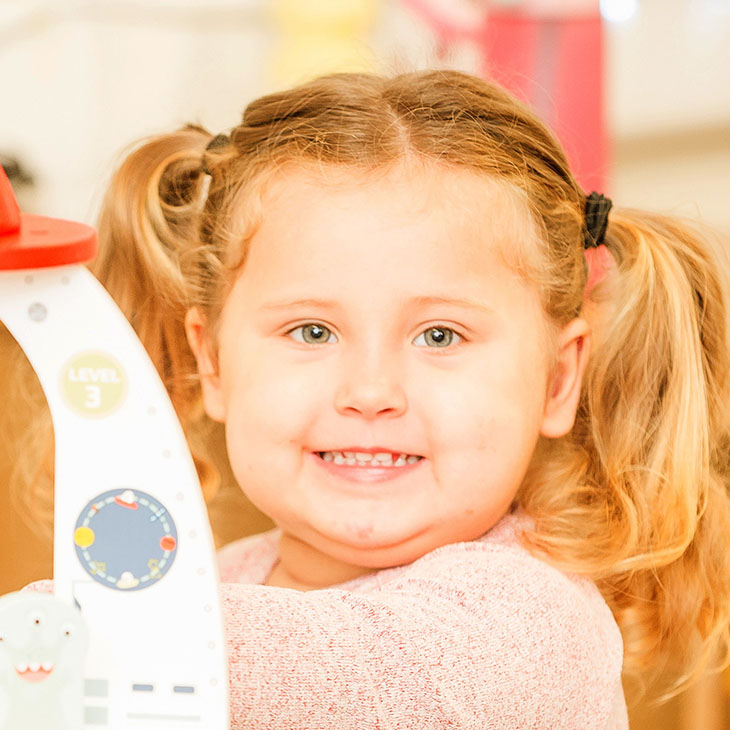 Smiling girl with pigtails
