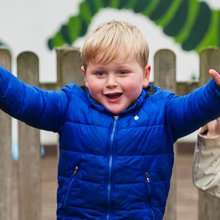 Boy with his arms outstretched 